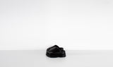 black shiny leather slippers