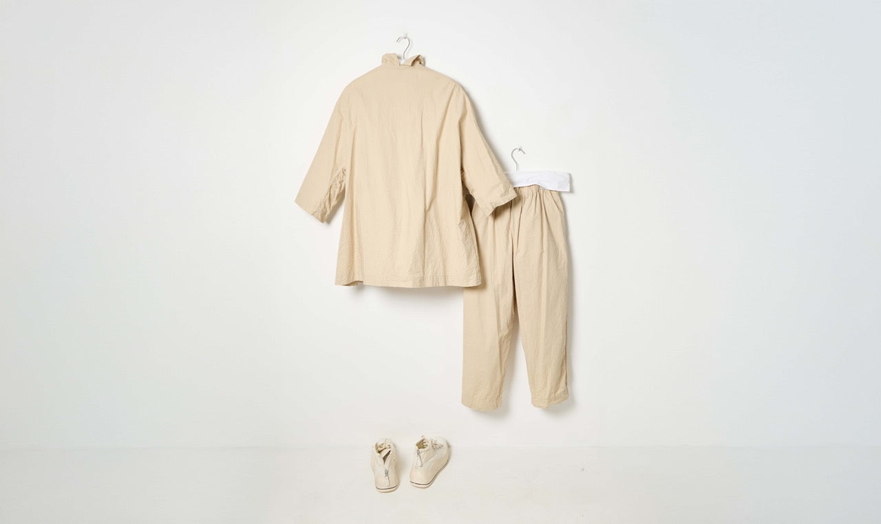 natural beige cotton trousers and light cotton coat look