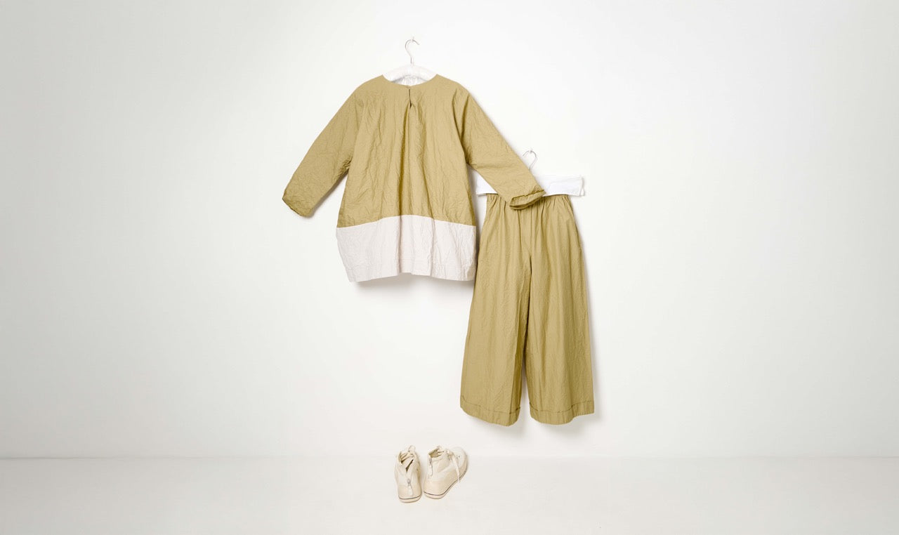 khaki cotton trousers and blouse look