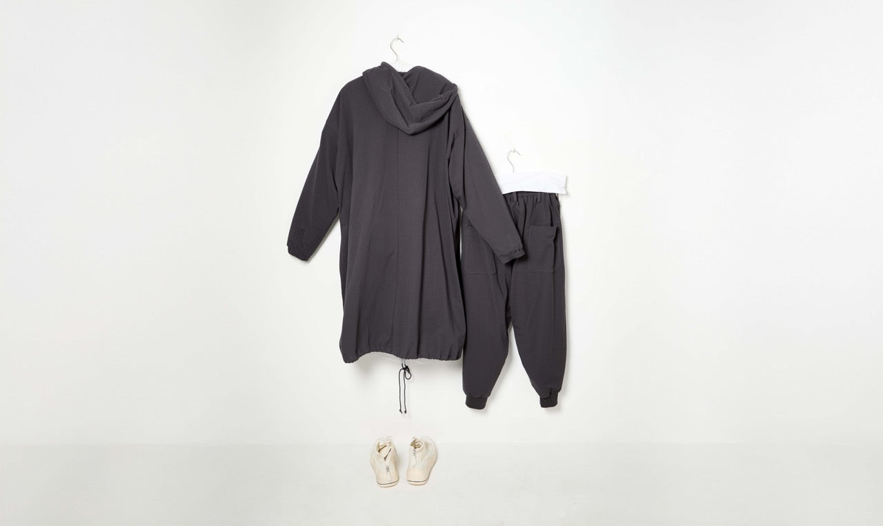 grey cotton trousers, sweather and raincoat outfit