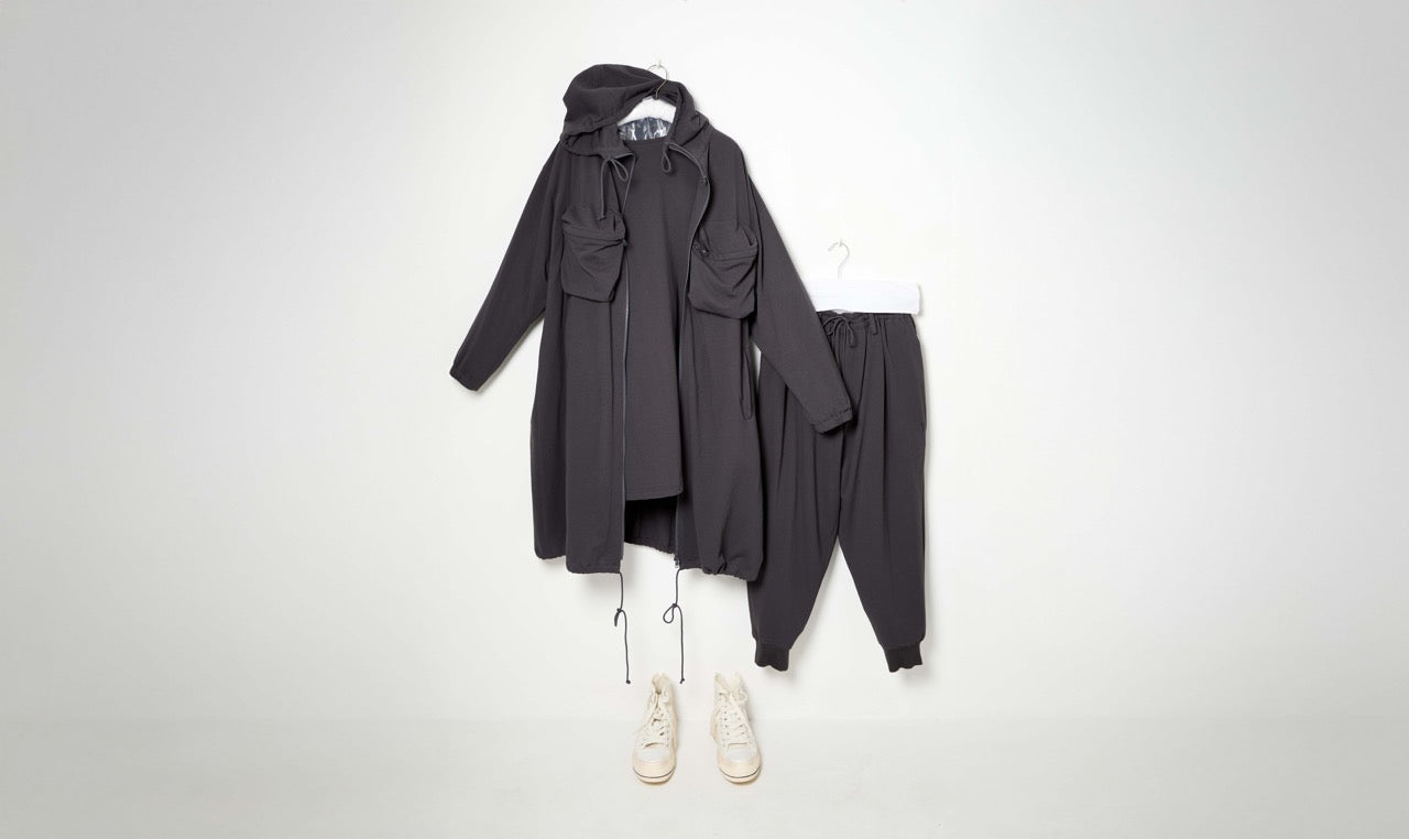 grey cotton trousers, sweather and raincoat outfit