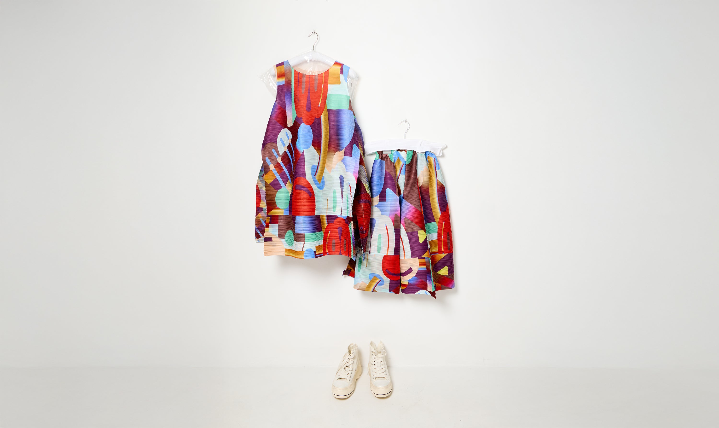 red/multicolor pleated dress and trousers look