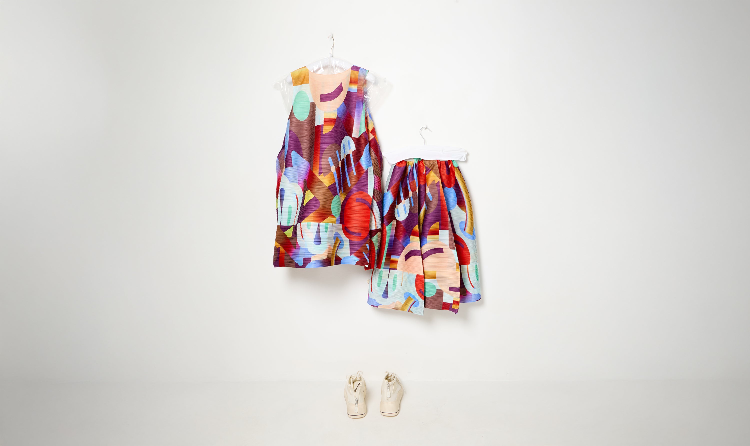 red/multicolor pleated dress and trousers look