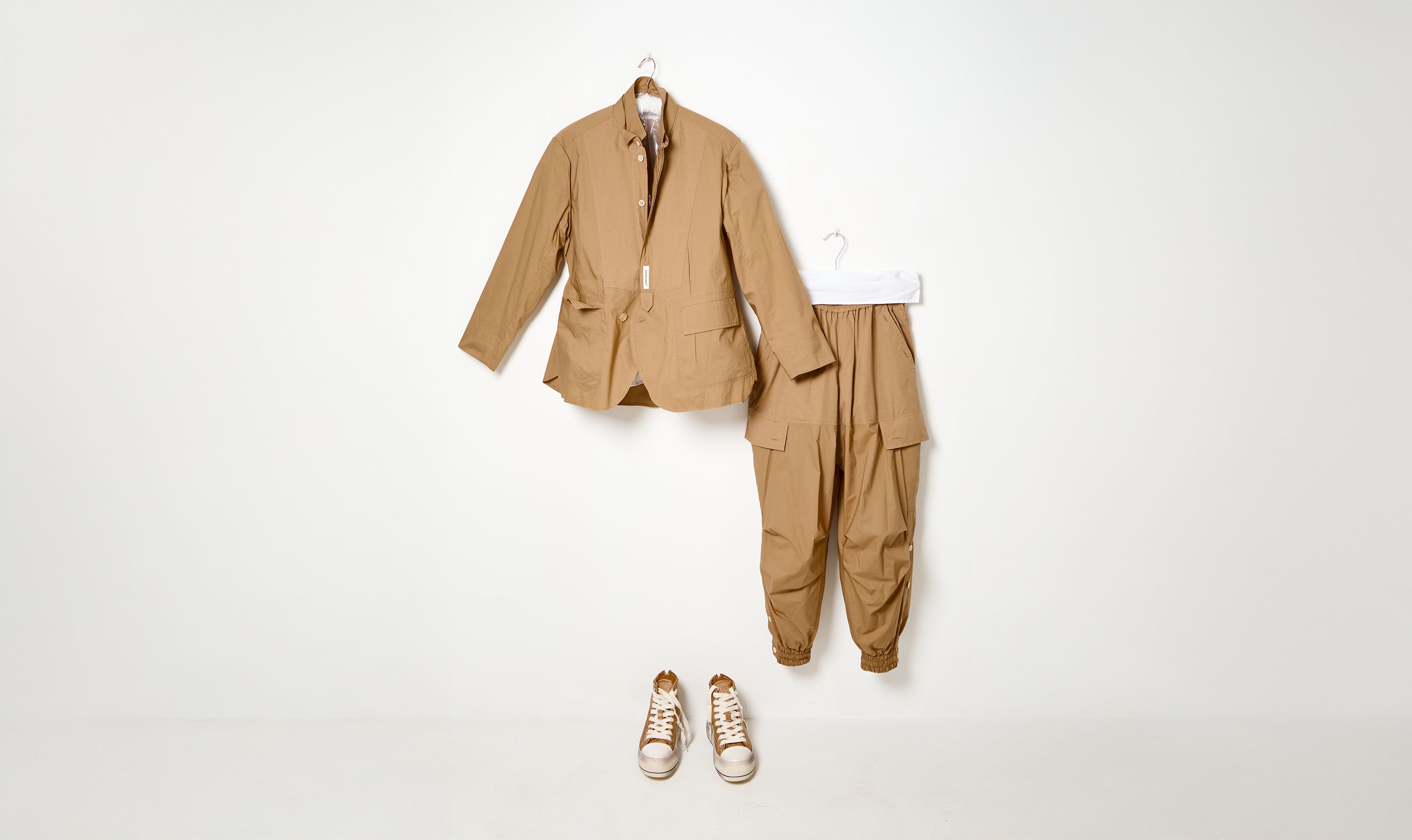 beige undercover trousers and jacket outfit