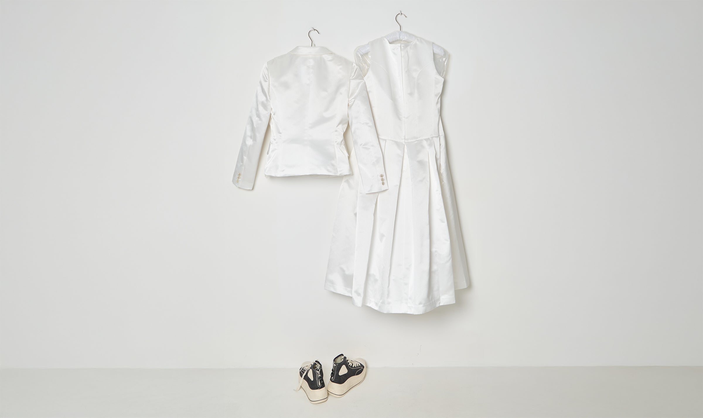 white draped jacket and dress