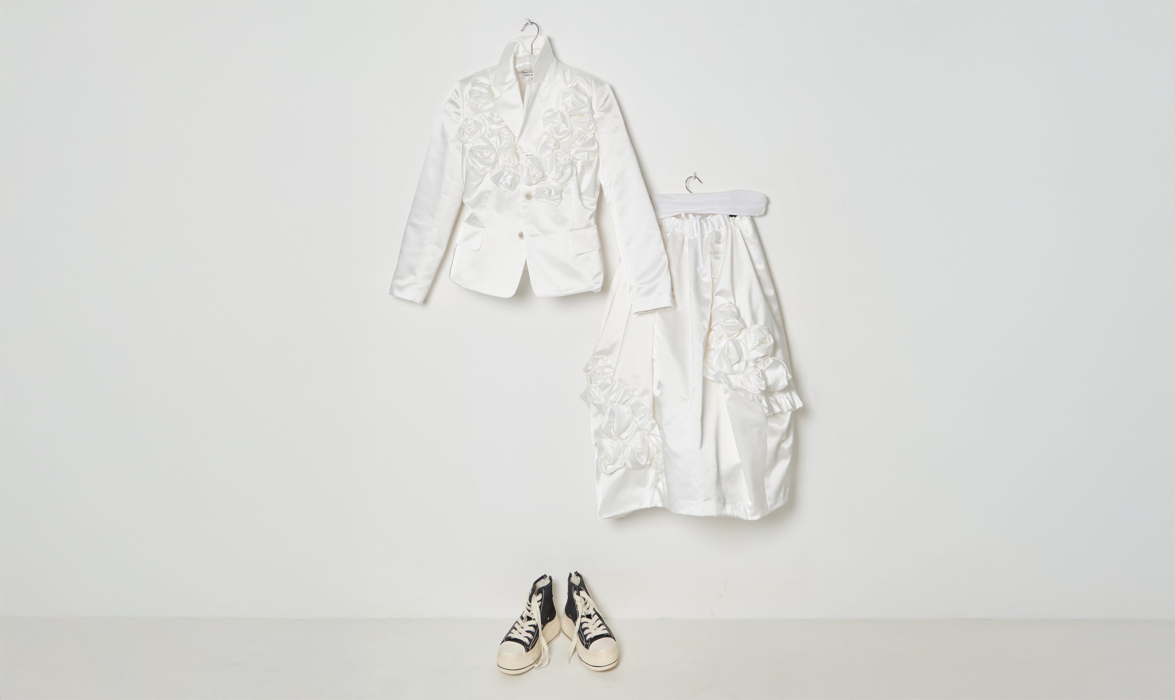 white draped jacket and skirt outfit