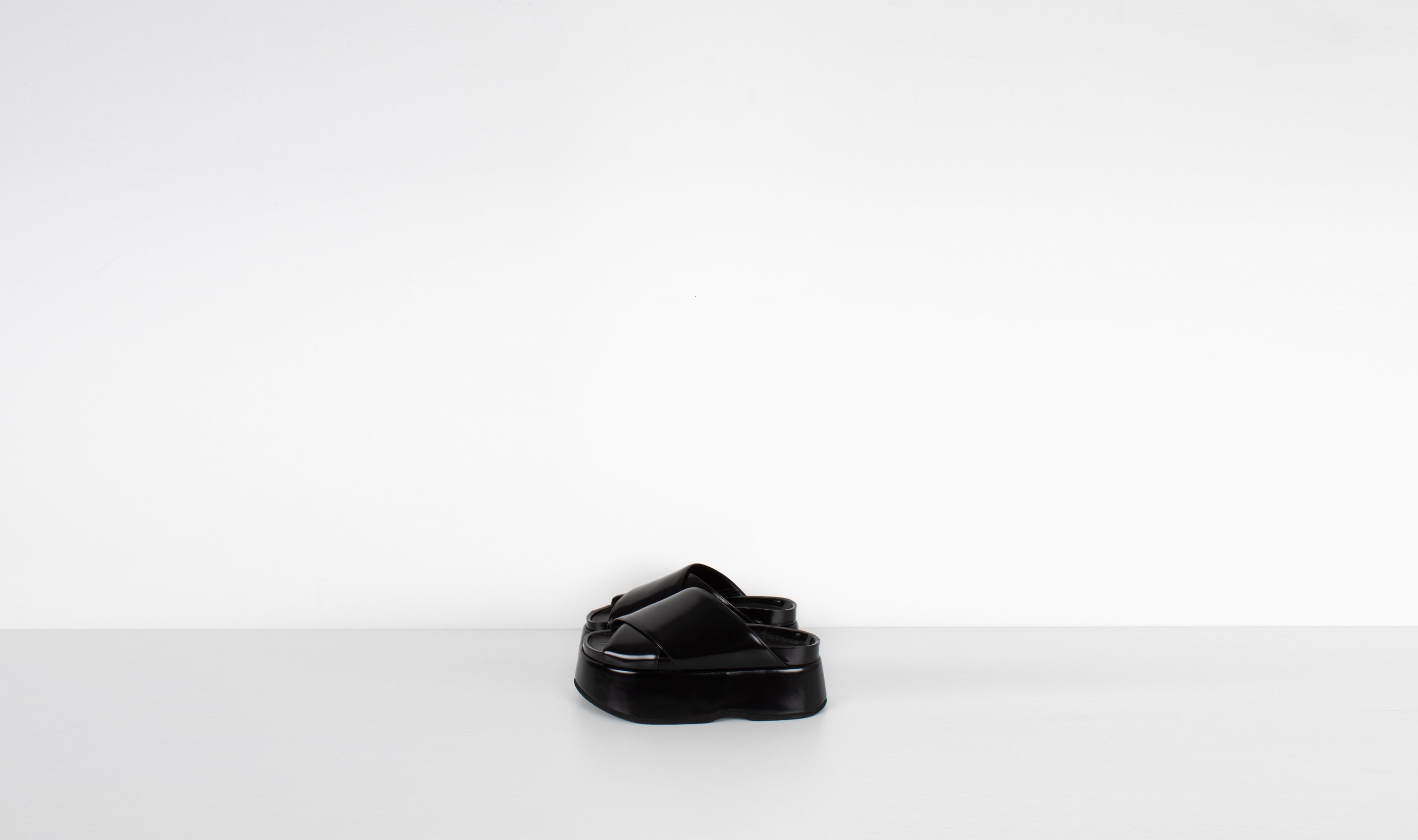 black shiny leather slippersJUNYA WATANABE