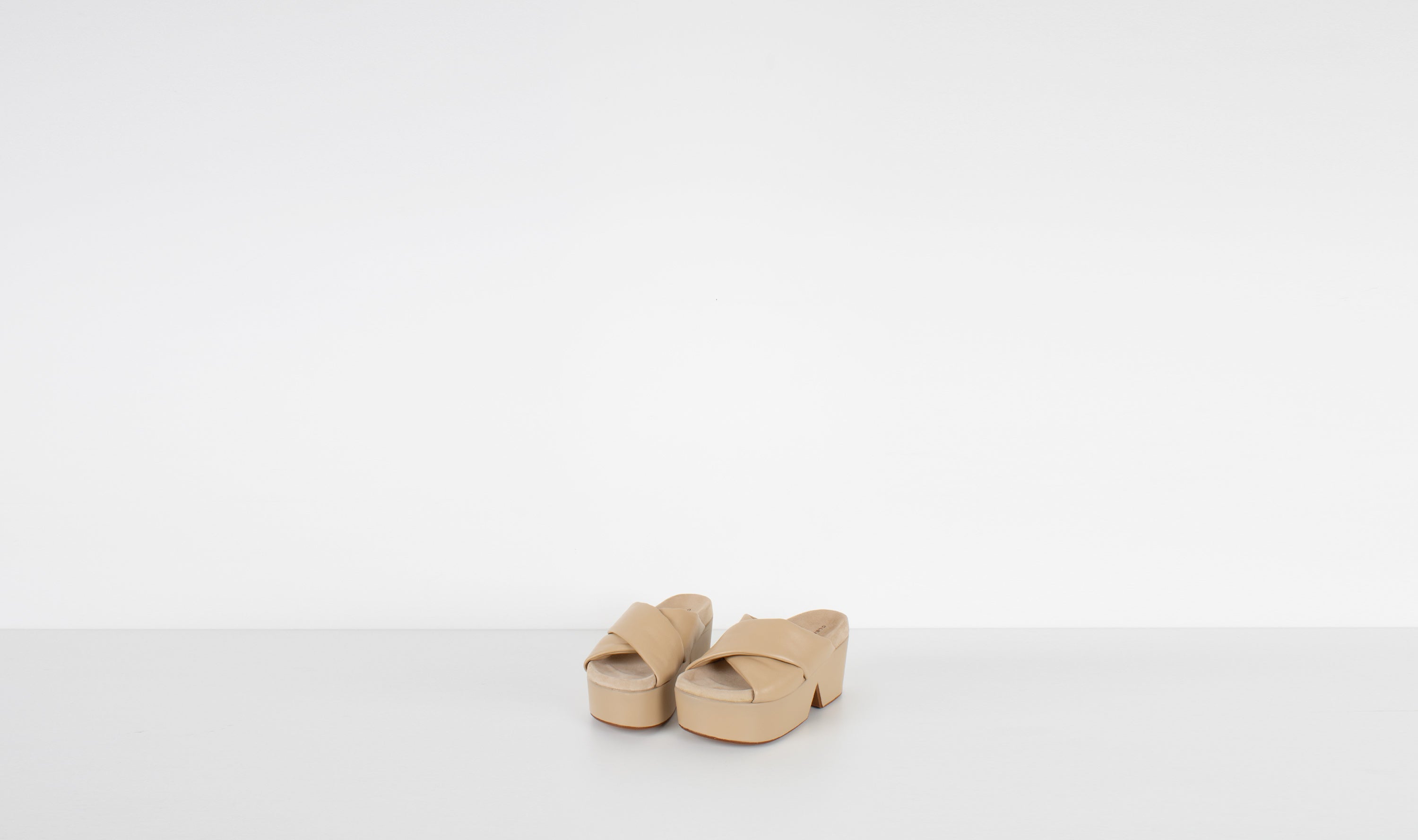 beige leather slippers