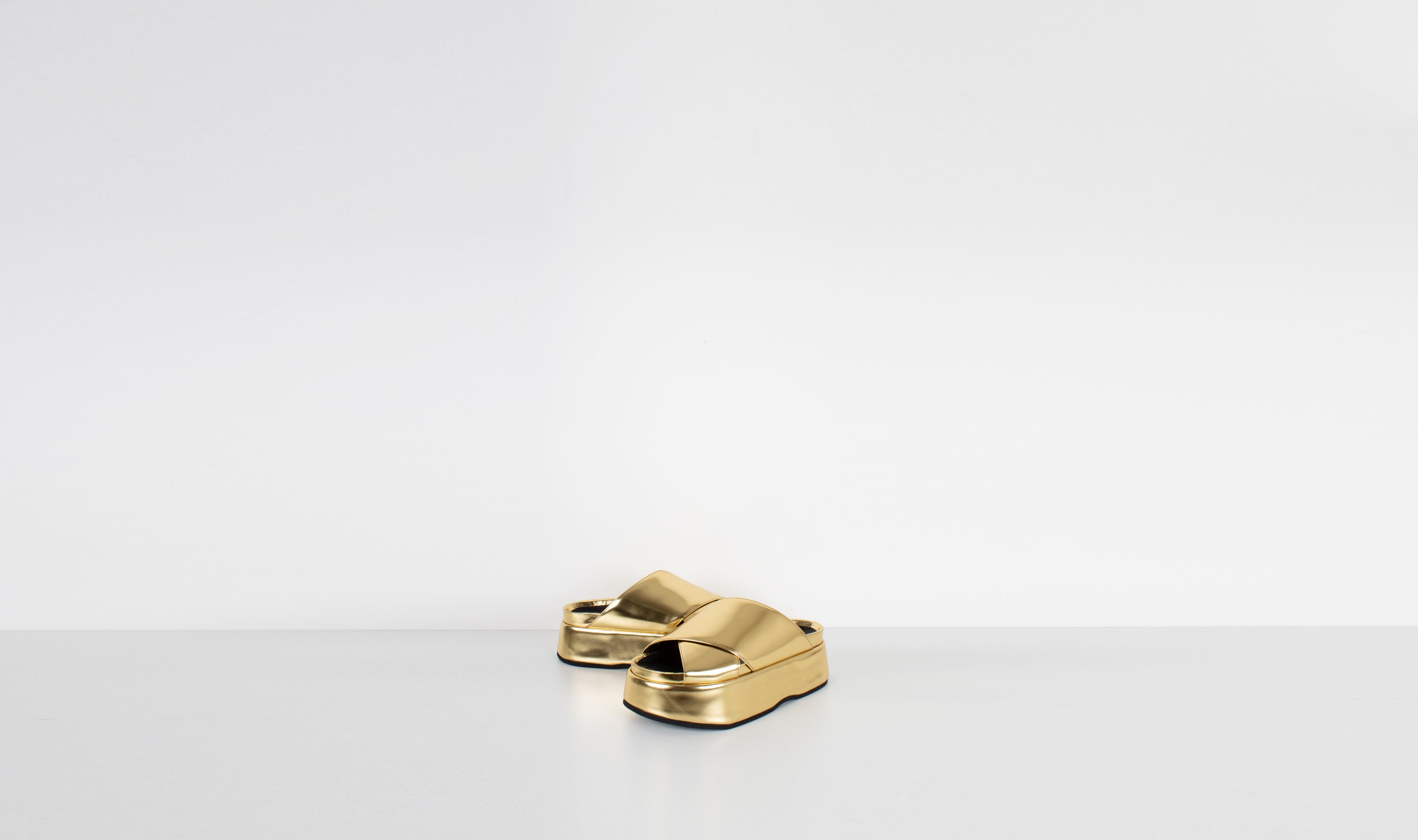 gold shiny leather slippers