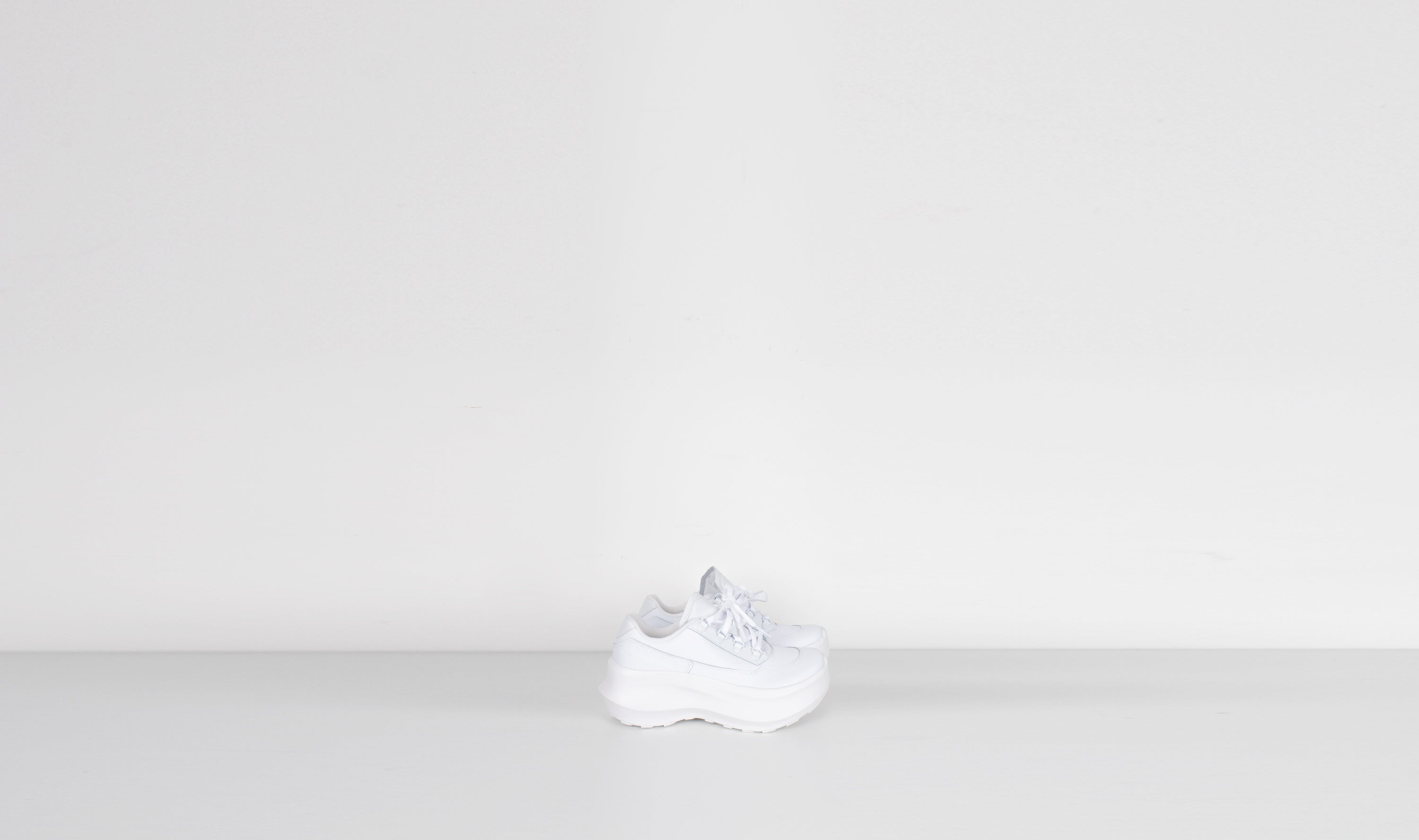 white leather salomon sneakers