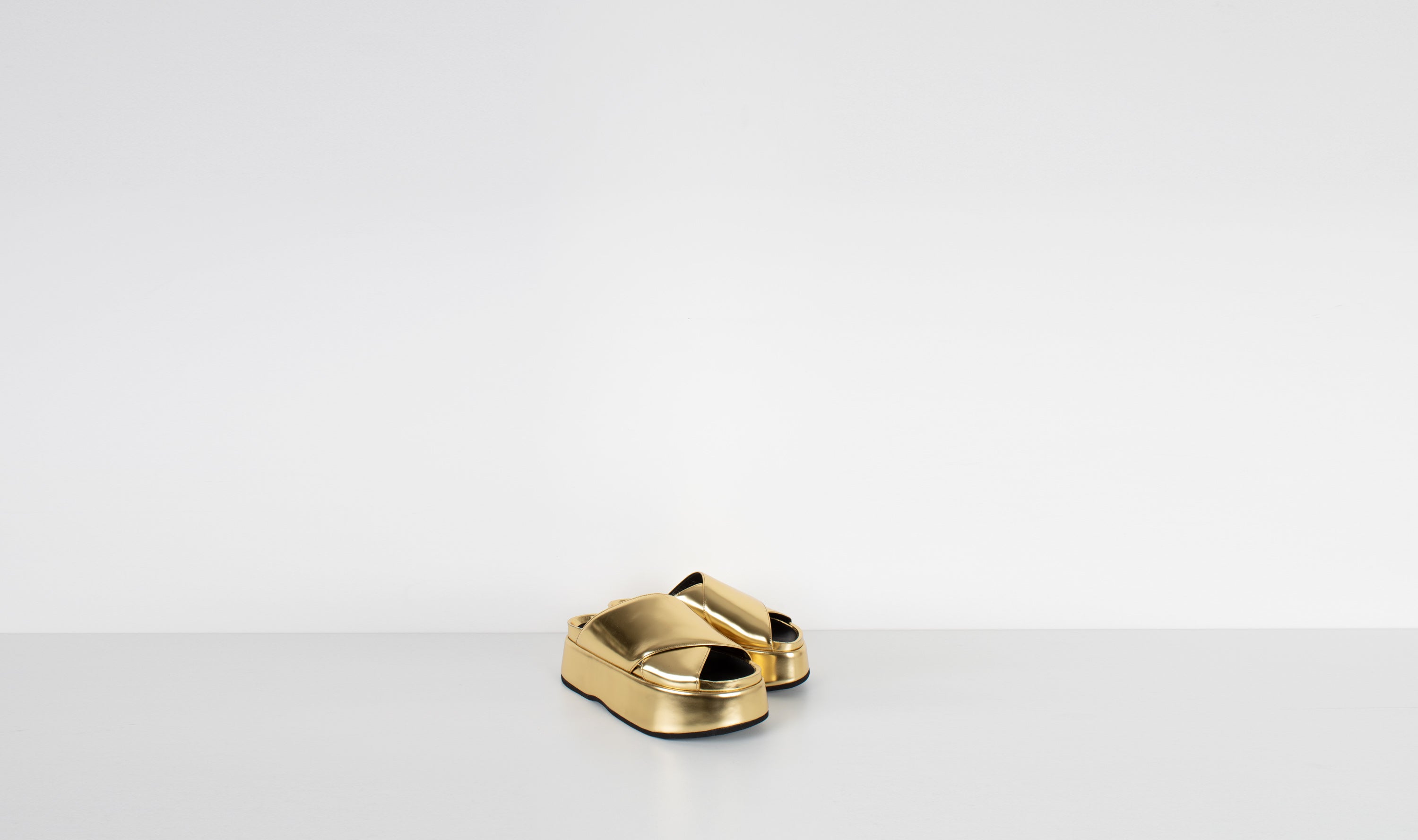 gold shiny leather slippersJUNYA WATANABE