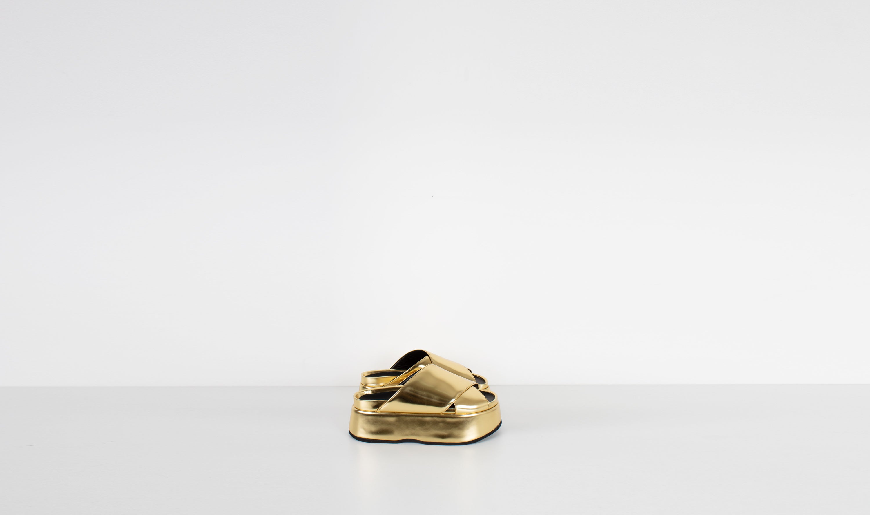 gold shiny leather slippersJUNYA WATANABE