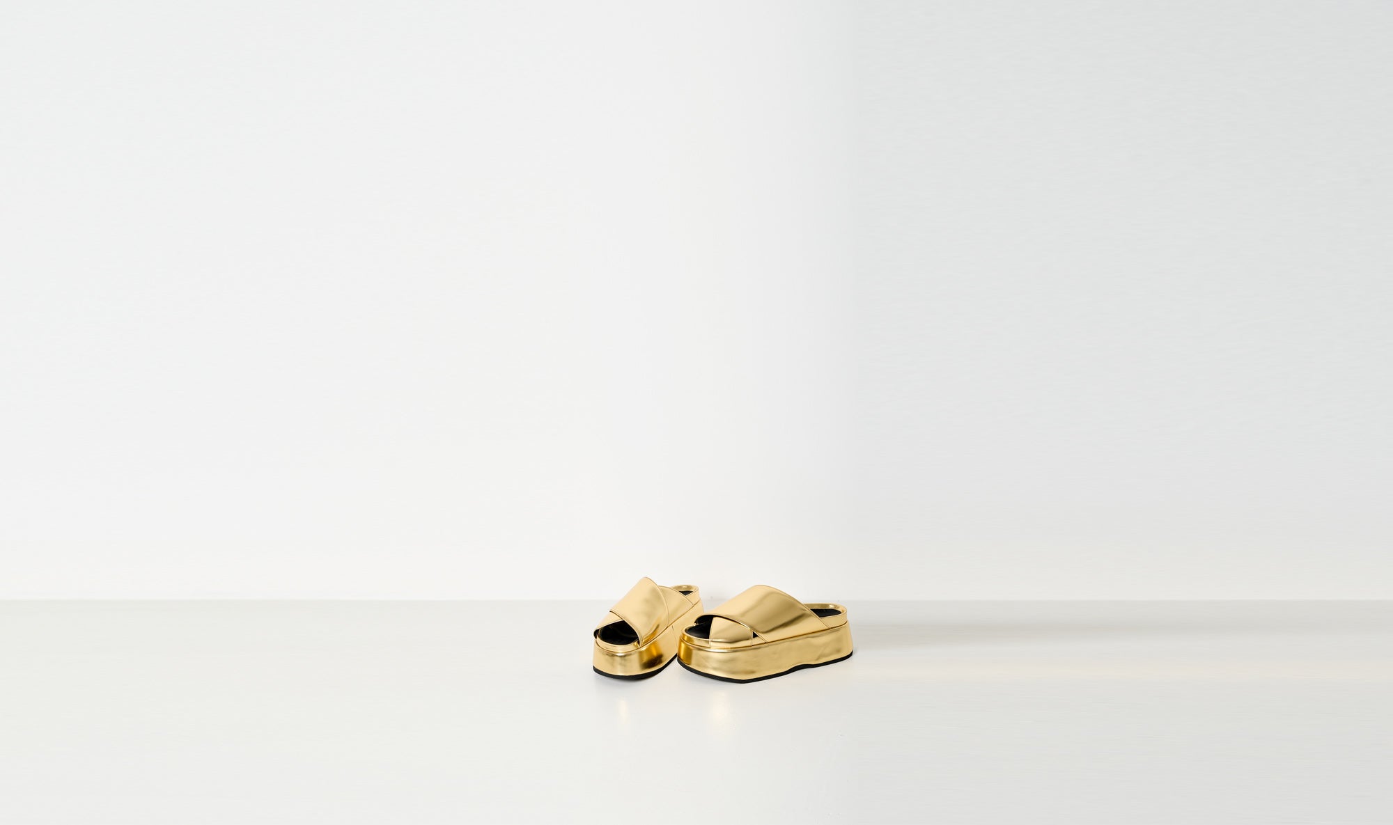 gold shiny leather slippers