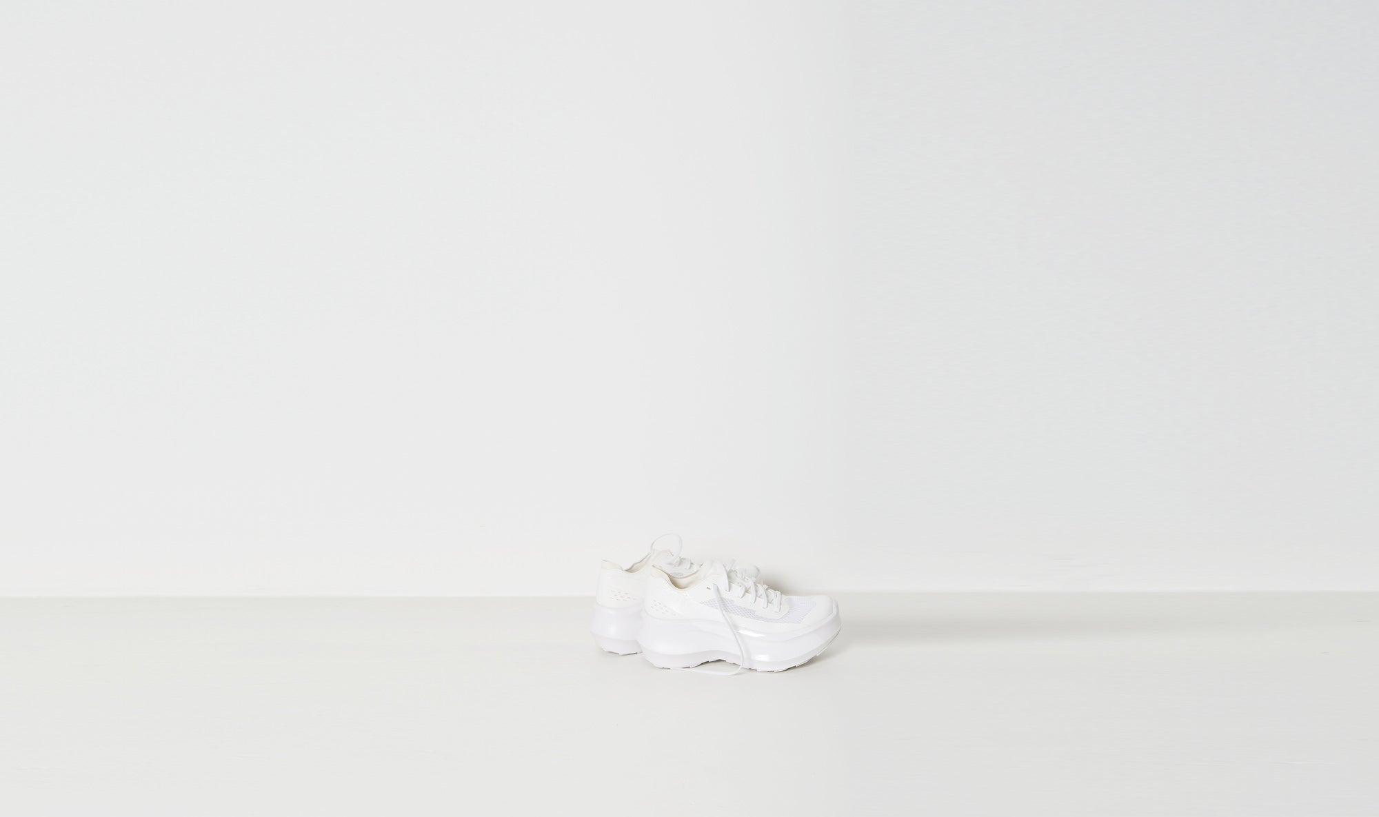 white salomon sneakers