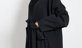 vestito nero asimmetrico lana